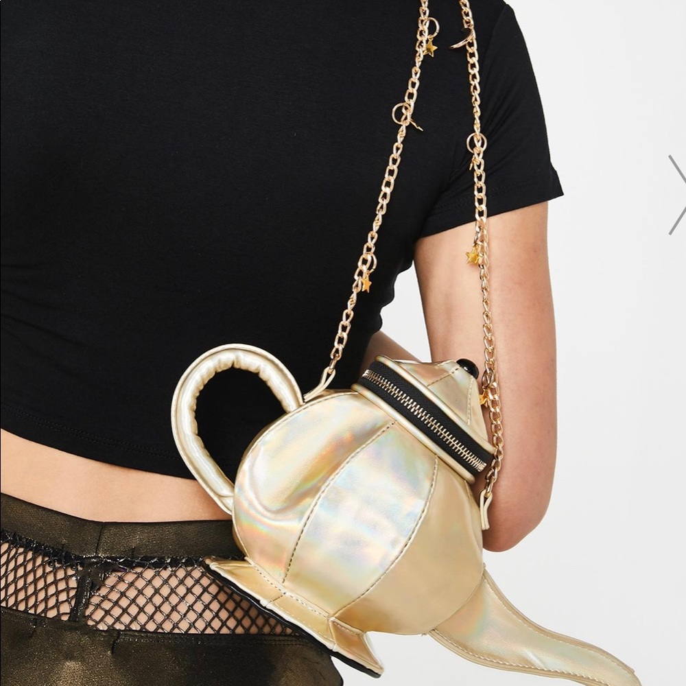 Metallic genie cross body bag from Dolls Kill